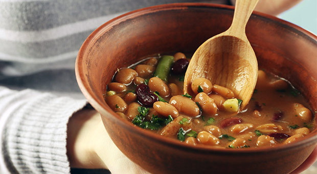 bigstock-Female-hands-with-beans-soup-i-86544527.jpg